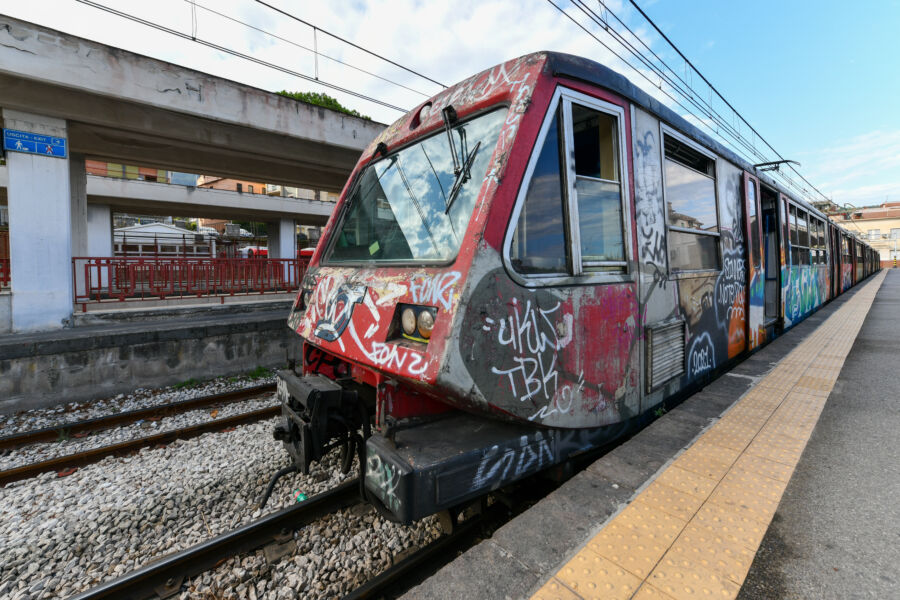 Circumvesuviana train at Sorrento station, Italy, showcasing its vibrant colors and scenic surroundings