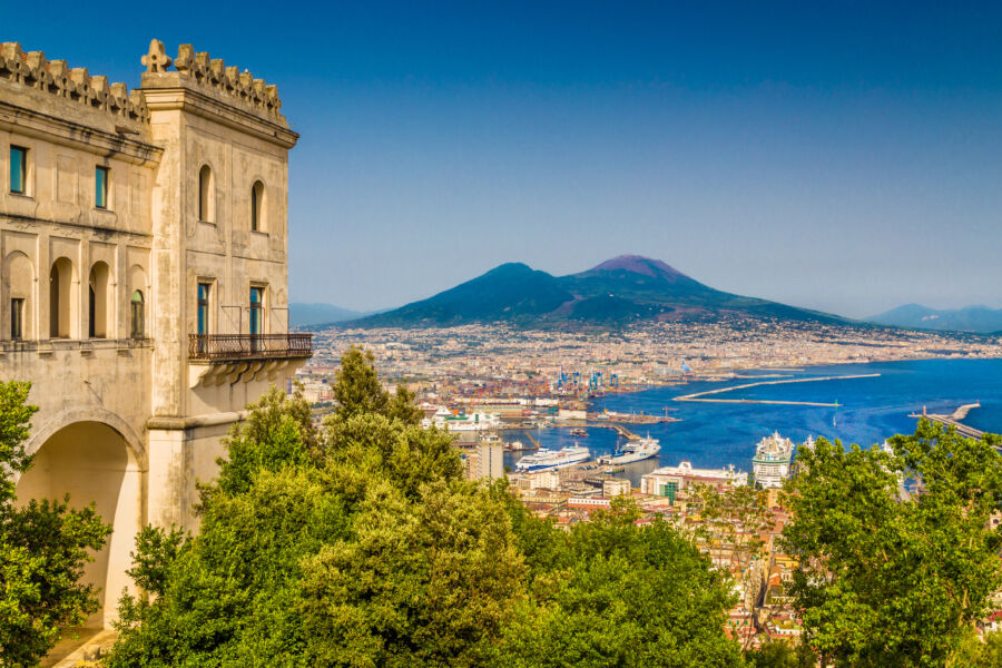 Scenic Naples cityscape featuring Mt. Vesuvius, highlighting the beautiful blend of urban life and natural beauty