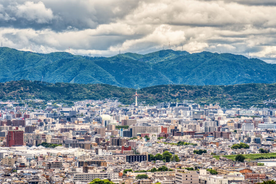 Aerial view of Kyoto city featuring the iconic Nidec Kyoto Tower adjacent to the train station