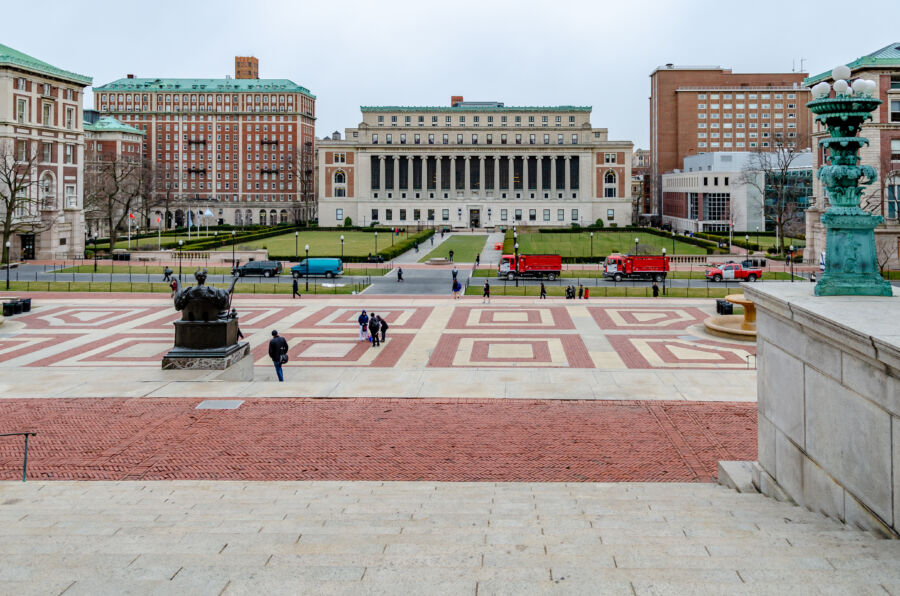 View from Columbia University Library featuring a staircase, students, and a winter park meadow in New York City