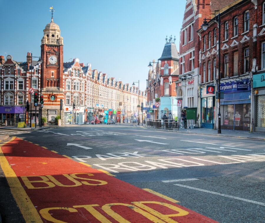 Panoramic view of Crouch End street in London, showcasing urban architecture and bustling city life