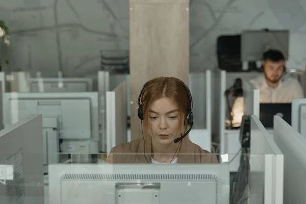 A woman working as a customer support agent