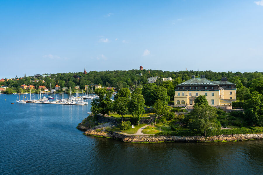 Panoramic view of Stockholm, showcasing Djurgarden Island and Skansen Park on a sunny summer day