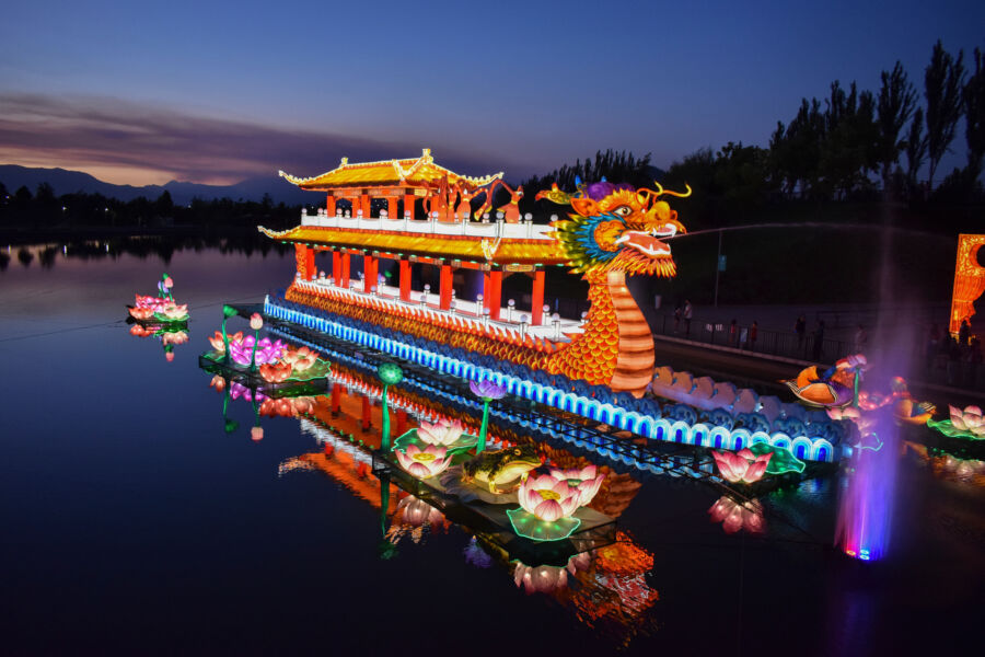 Vibrant display of lights illuminating the night sky during the Dragon Boat Festival celebration