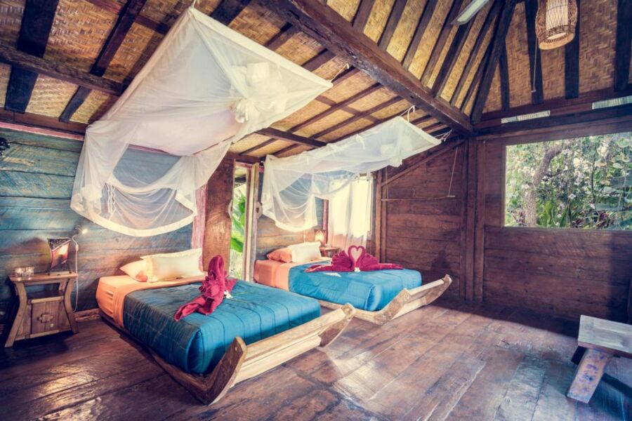 Bed and room interior at Dragonfly Village, Bali, Indonesia