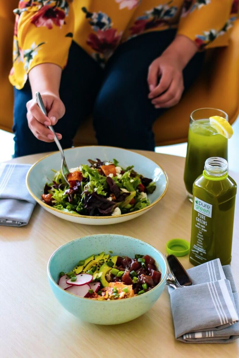 Lady eating greens and smoothie drinks