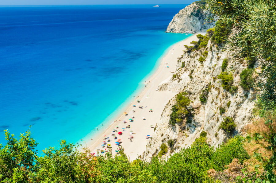 Scenic view of Egremni Beach in Lefkada, Greece, featuring turquoise waters and a long stretch of sandy shoreline