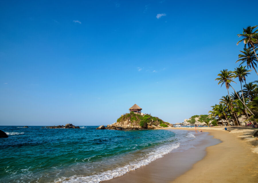 Scenic view of El Cabo San Juan del Guia beach in Tayrona National Park, showcasing its pristine sands and lush surroundings