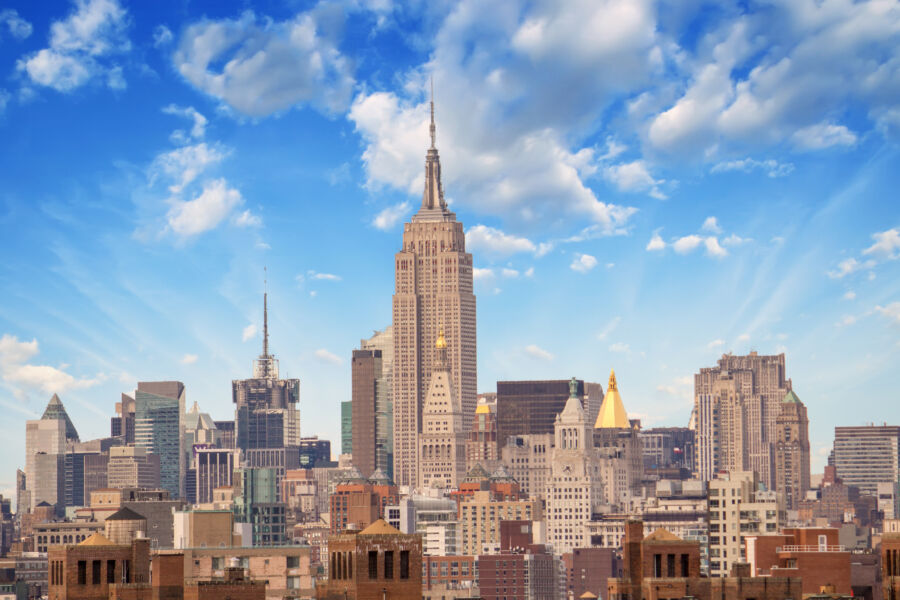 Empire State Building radiates light, showcasing its iconic presence in the New York City skyline