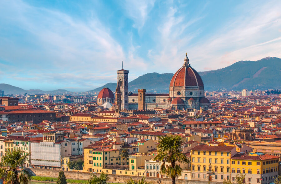 Sunset over Florence as seen from Piazzale Michelangelo, highlighting the city's architecture and vibrant sky colors