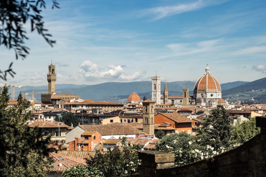 Panoramic view of Florence skyline with Duomo, Giottos Campanile, and Palazzo Vecchio.