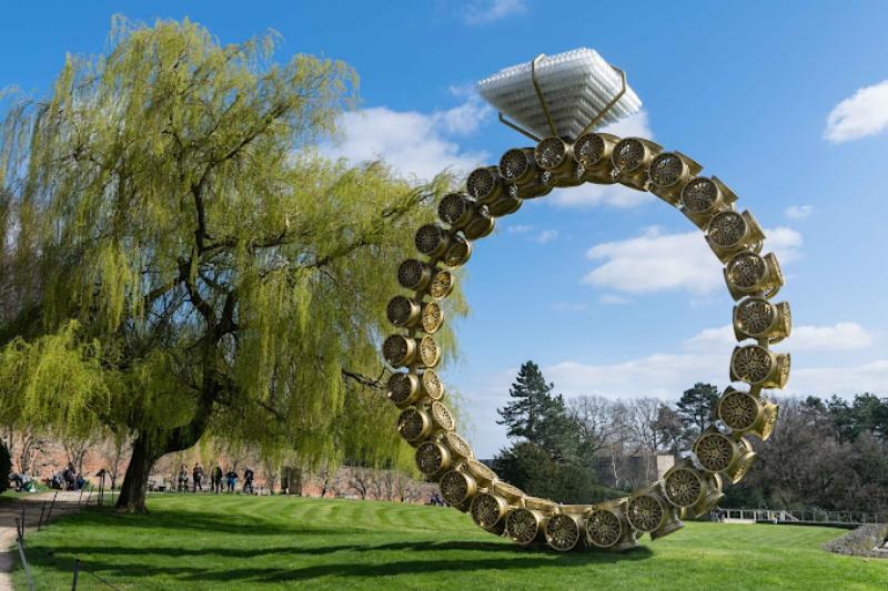 Giant golden coin ring sculpture at Yorkshire Sculpture Park