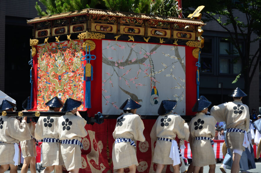 Gion Matsuri parade in Kyoto, featuring colorful floats and traditional costumes, celebrating Japanese culture and heritage