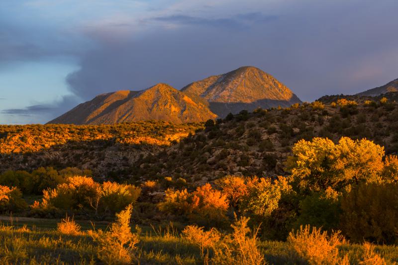 Golden hour glow over serene mountain in Taos,New Mexico