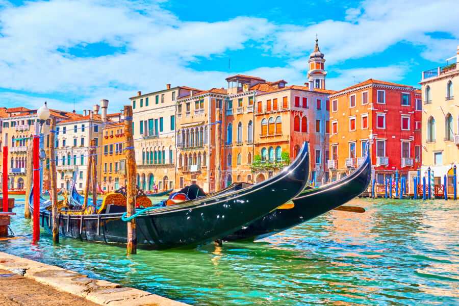 Panoramic view of the Grand Canal in Venice, showcasing boats and historic architecture along the waterway