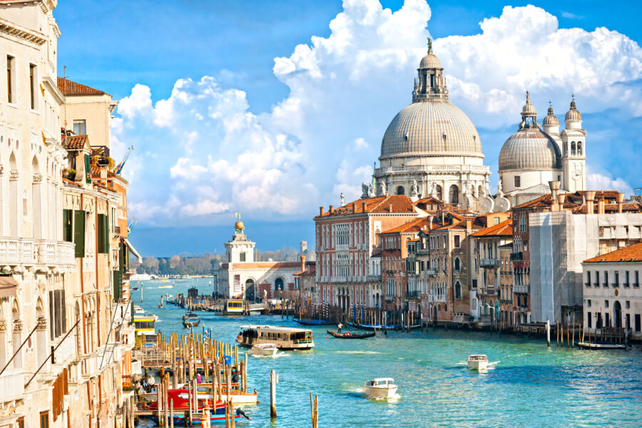 Scenic view of Venice's Grand Canal with the Basilica of Santa Maria della Salute prominently displayed against the skyline