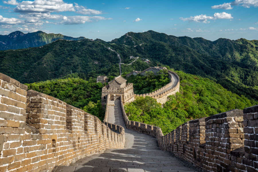 Panoramic view of the Great Wall of China in Beijing, showcasing its majestic structure against a scenic landscape