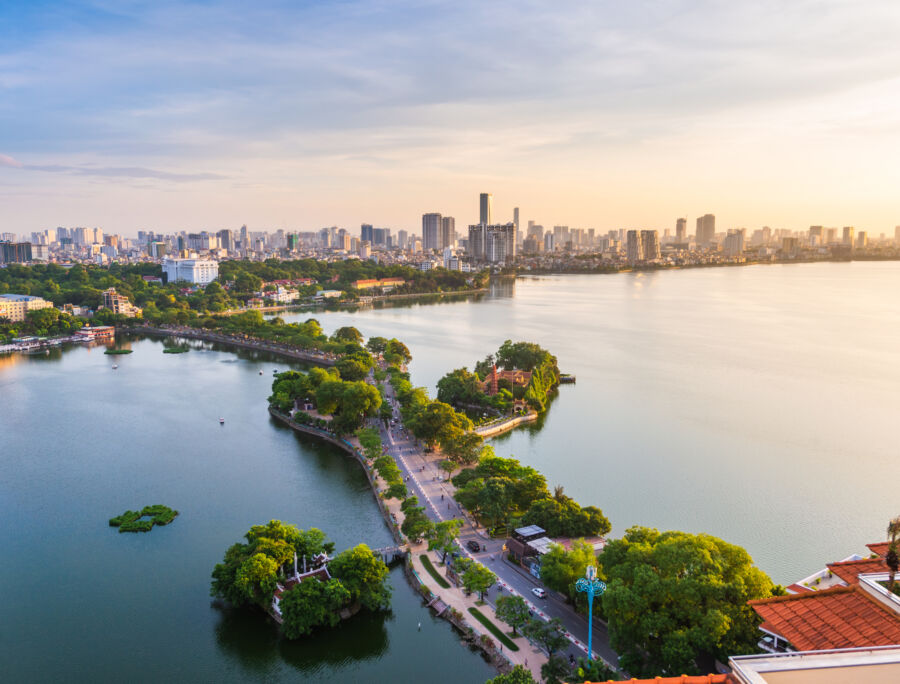 Sunset panorama of Hanoi, highlighting the city's skyline with warm hues and the tranquil atmosphere of dusk