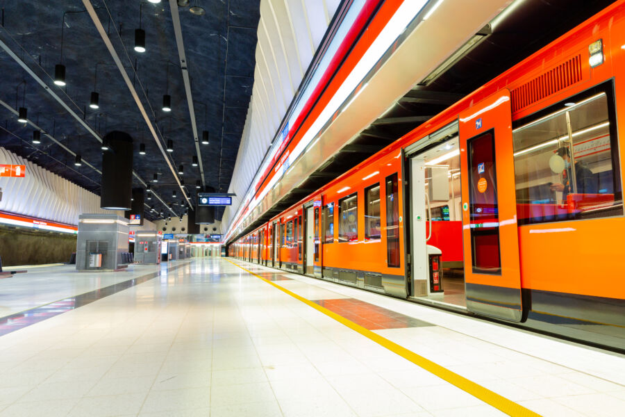 Open doors of the Helsinki Metro station, featuring a striking orange color