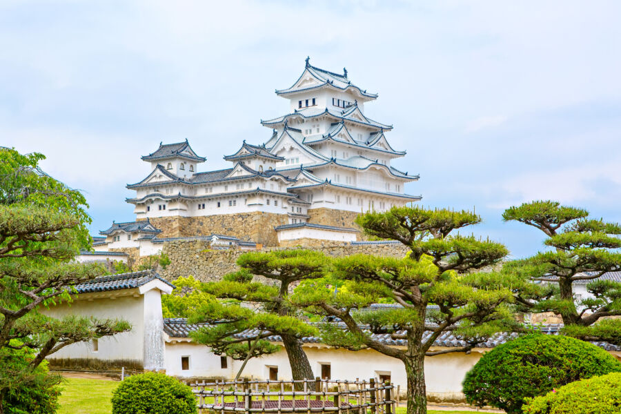 The elegant white facade of Himeji Castle rises beautifully, showcasing its historic architecture in Himeji, Japan