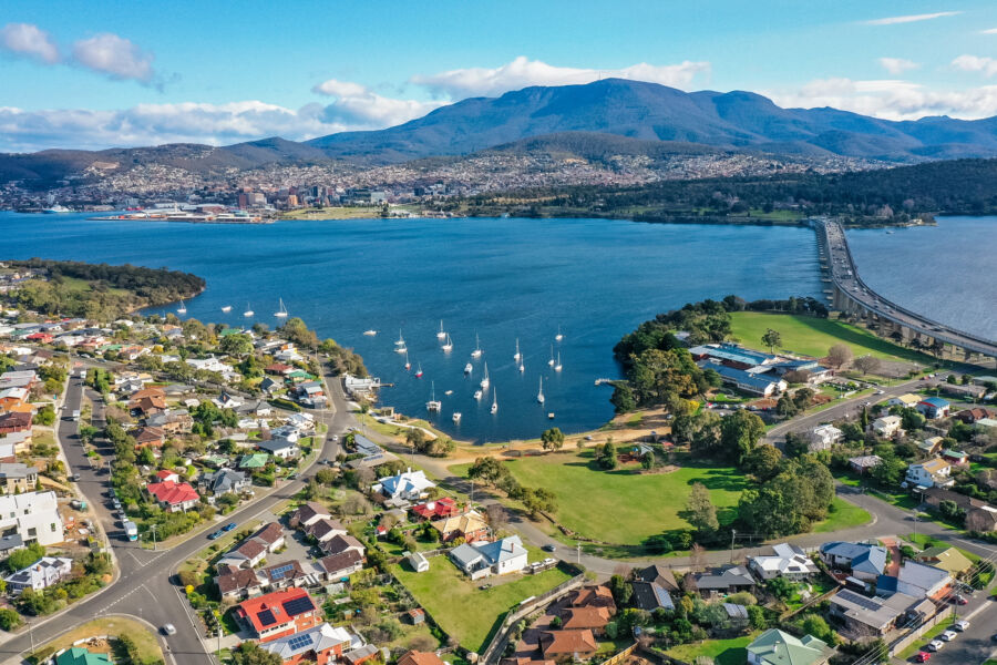 Aerial view showcasing the Derwent River, Mt Wellington, and the cityscape of Hobart, Tasmania, Australia