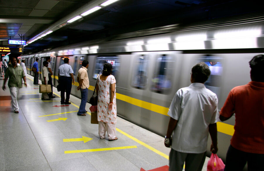 passengers awaiting metro train, delhi, india