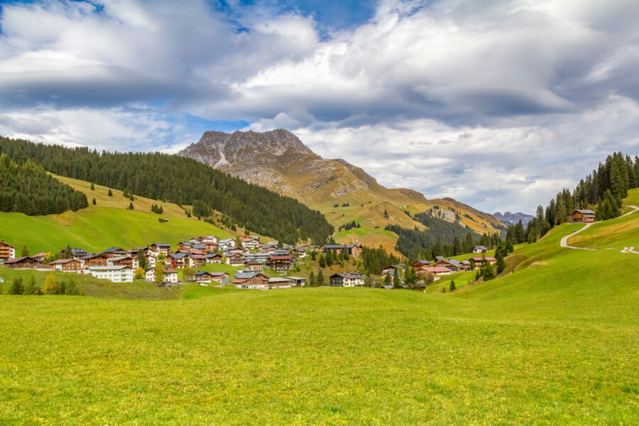 Scenic view of Lech am Arlberg in the Bludenz district, showcasing mountains and lush greenery in Austria