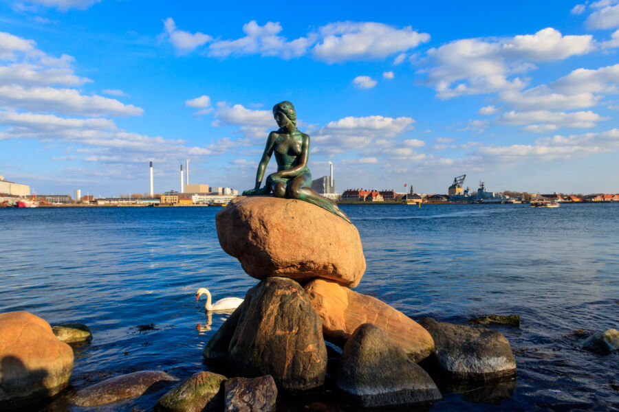 The Little Mermaid statue perched on a rock at Langelinie promenade, Copenhagen, designed by Edvard Eriksen