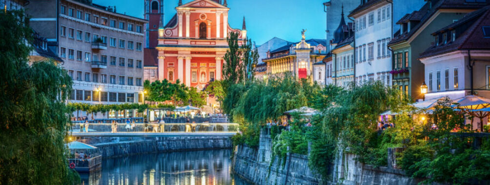 Evening view of the bridge and Ljubljanica river in the city center. Ljubljana, capital of Slovenia.