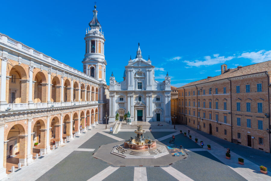 Scenic view of Piazza della Madonna featuring the Sanctuary of the Holy House of Loreto, a significant Italian landmark