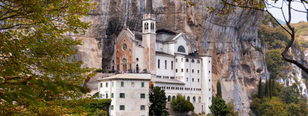 The Madonna della Corona Sanctuary in Verona, Italy, is a picturesque church set against dramatic cliffs and scenic views