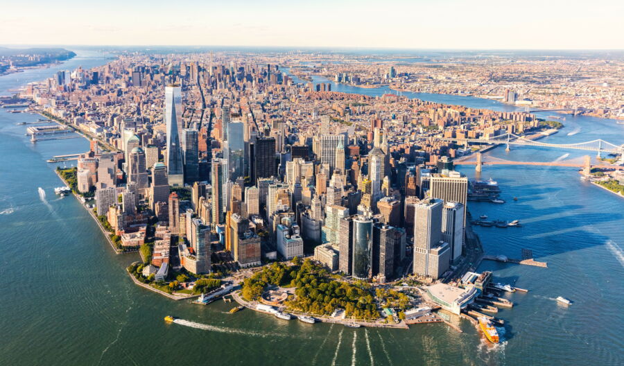 Aerial view showcasing lower Manhattan, highlighting iconic skyscrapers and the bustling urban landscape of New York City