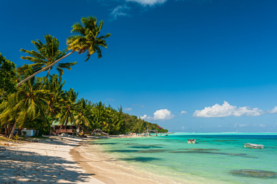 Panoramic view of Matira Beach in Bora Bora, showcasing its turquoise waters and lush surroundings in French Polynesia