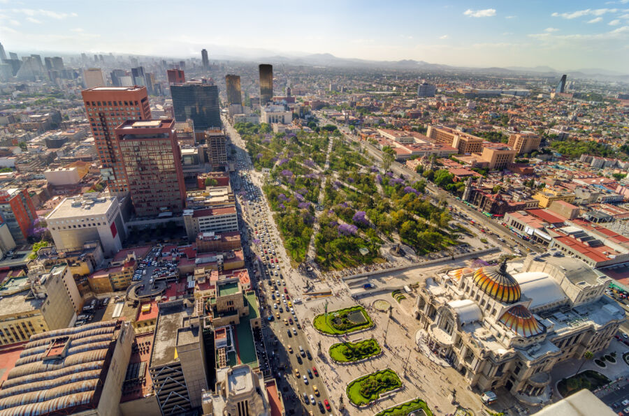 Aerial view of Mexico City showcasing its vibrant urban landscape, featuring skyscrapers and sprawling neighborhoods