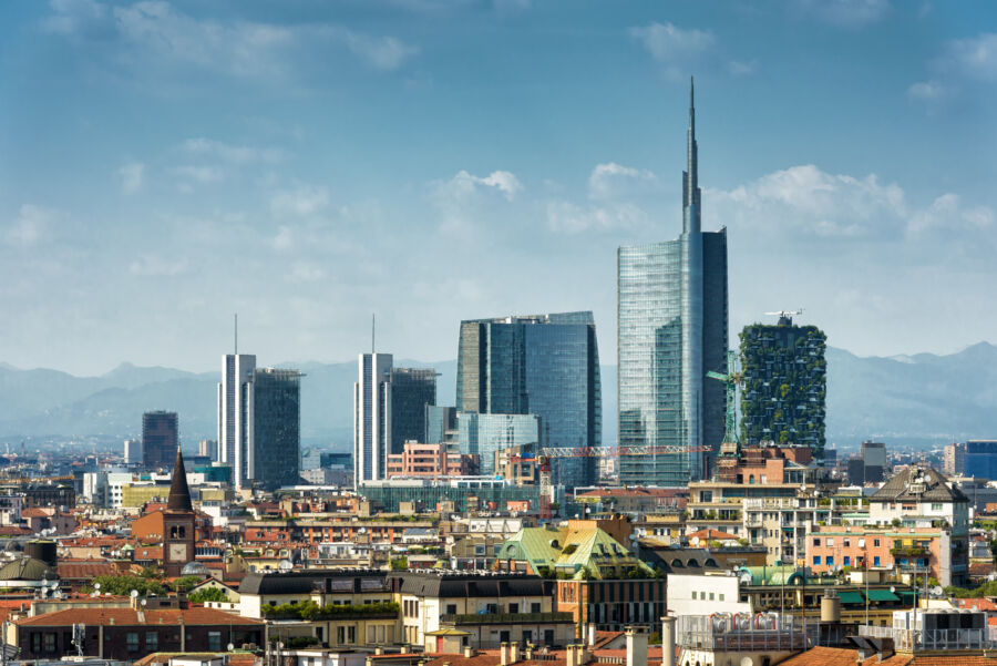 Milan skyline featuring modern skyscrapers against a clear blue sky, showcasing Italy's architectural innovation