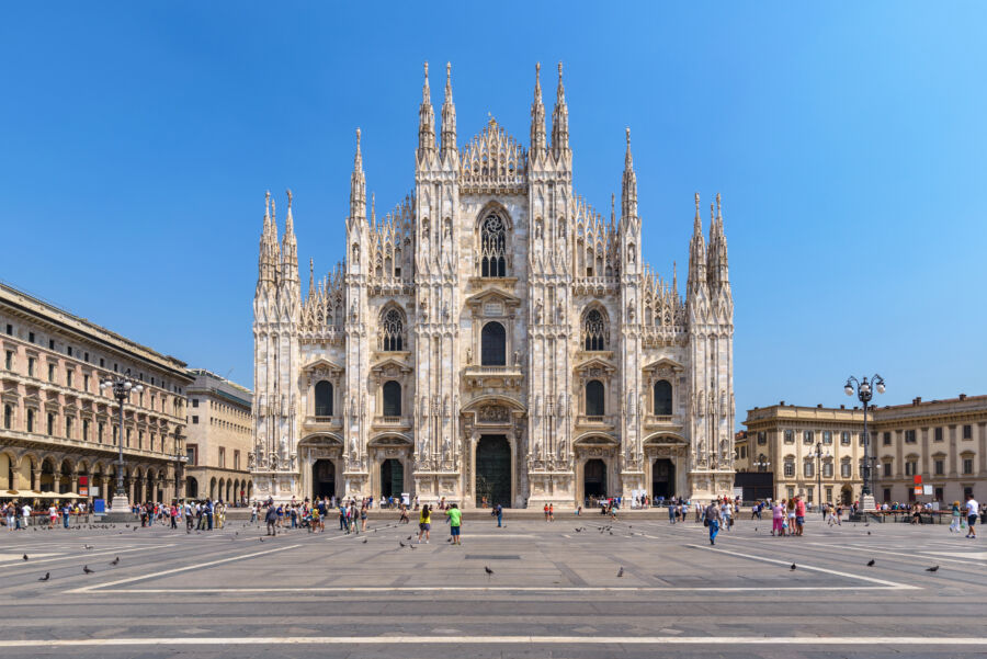 Exterior view of the Milan Duomo, showcasing its intricate Gothic architecture and stunning façade in Milan, Italy