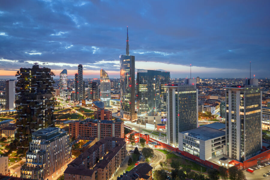 Milan's cityscape at night, featuring a breathtaking display of lights illuminating the urban landscape