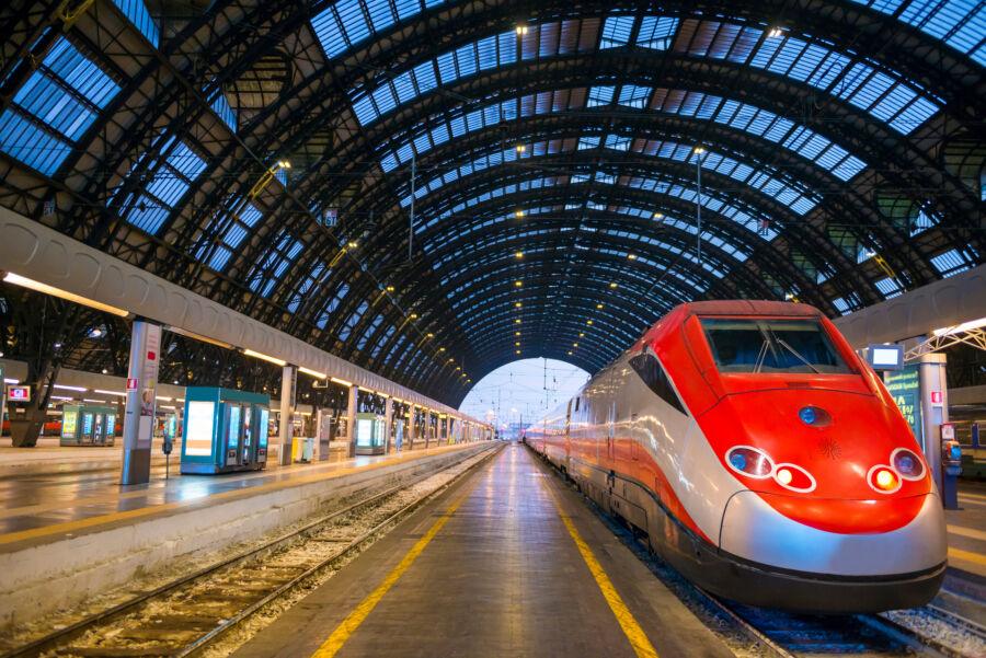 Milan's railroad station showcases a train poised for travel in Italy