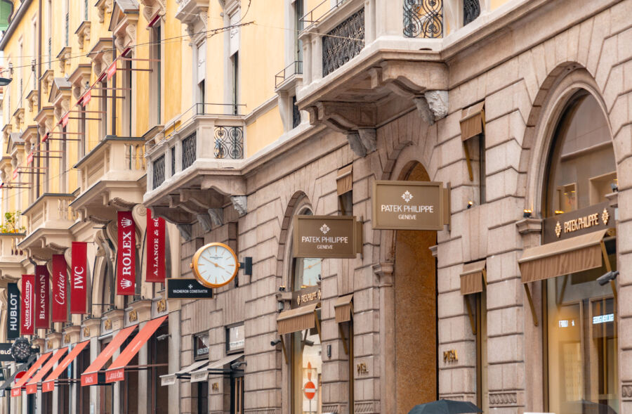 Panoramic view of Via Montenapoleone, an upscale shopping district in Milan, Italy, showcasing luxury boutiques and elegant architecture