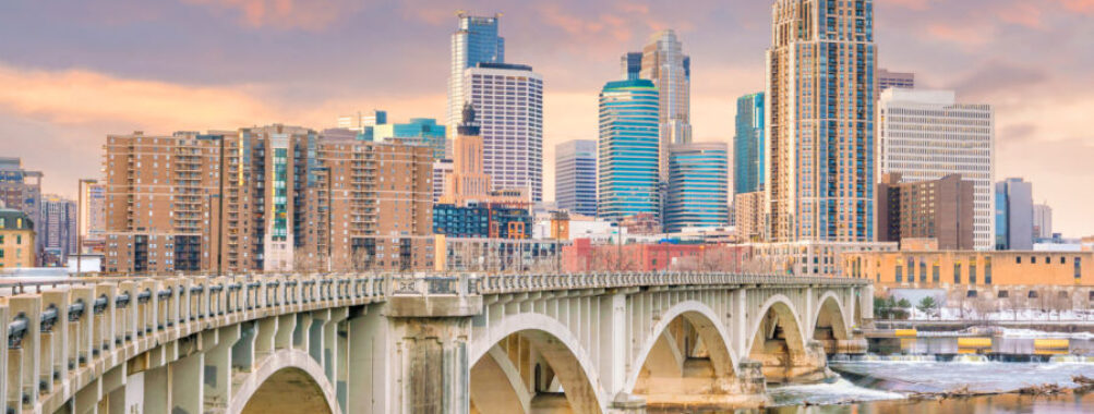 The Minneapolis downtown skyline features striking skyscrapers and urban landscapes, representing Minnesota's vibrant city life