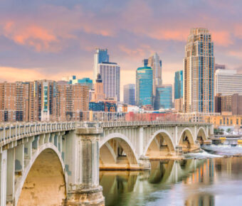 The Minneapolis downtown skyline features striking skyscrapers and urban landscapes, representing Minnesota's vibrant city life