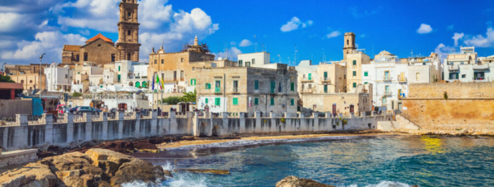 Scenic cityscape of Monopoli, Bari, showcasing charming architecture and coastal views under a clear blue sky