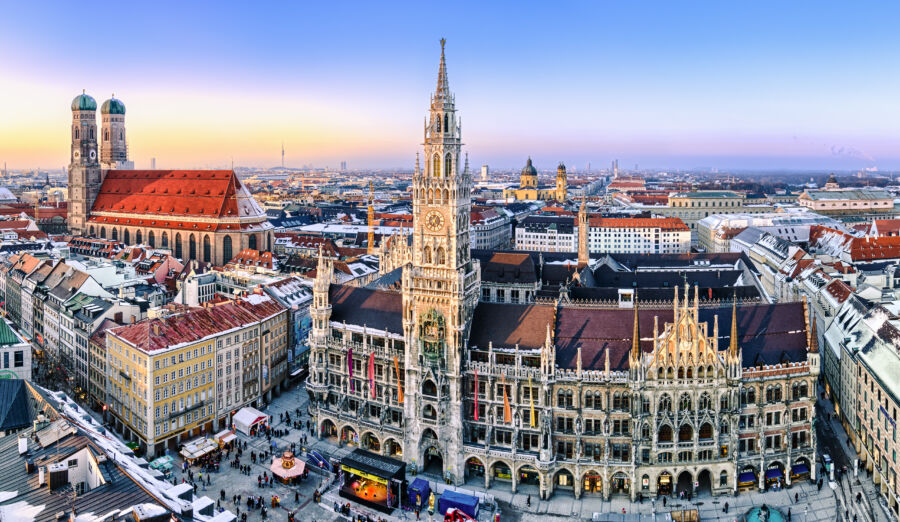 Sunset view of Munich, highlighting the skyline and the Marienplatz town hall within the urban landscape of Germany