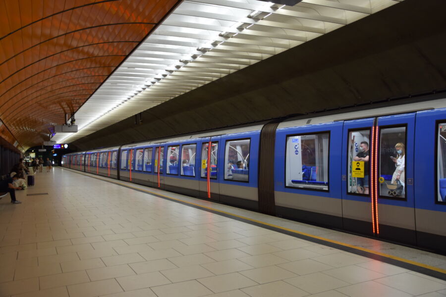 Blue U-Bahn trains at a Munich station, showcasing the city's efficient public transportation system