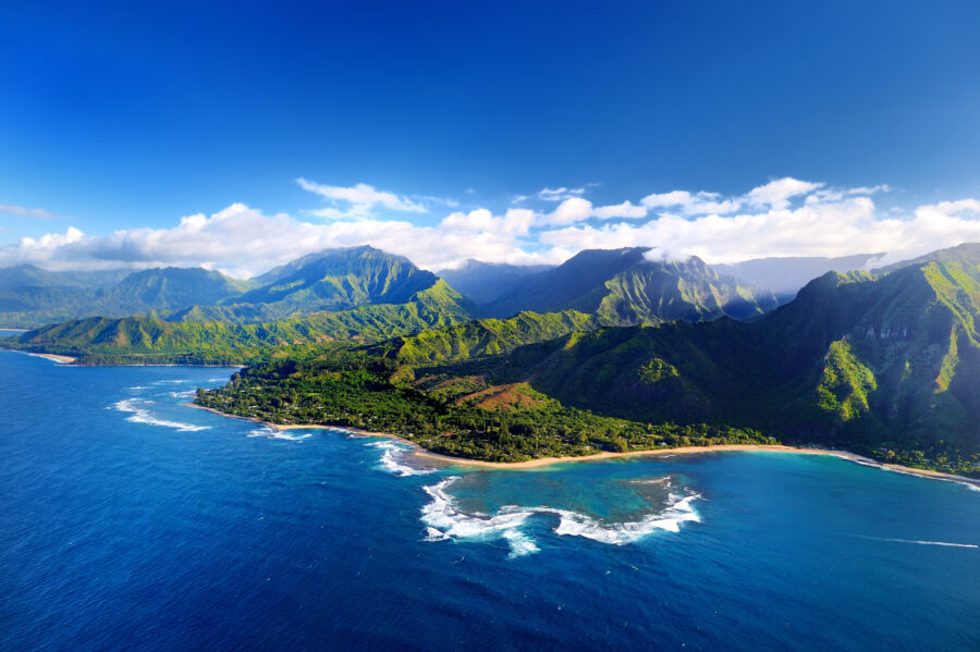 Aerial view of the stunning Na Pali Coast in Kauai, showcasing its dramatic cliffs