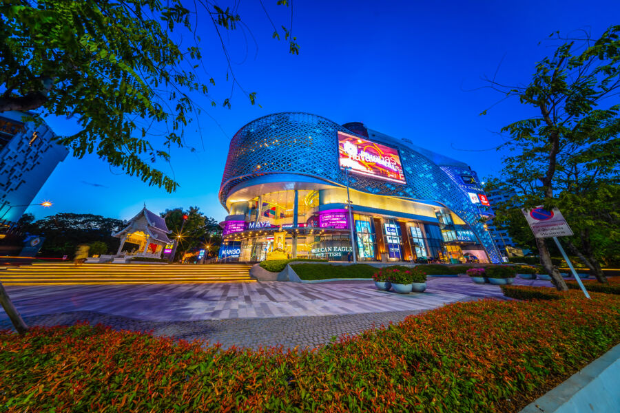 Night view of Chiang Mai City in front of MAYA shopping store on Nimmanhemin Road, showcasing vibrant city lights