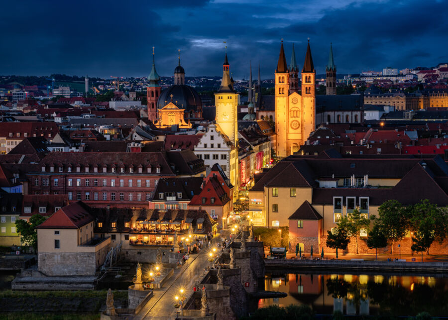 Nuremberg at night, featuring a stunning display of lights reflecting off historic architecture in a serene atmosphere