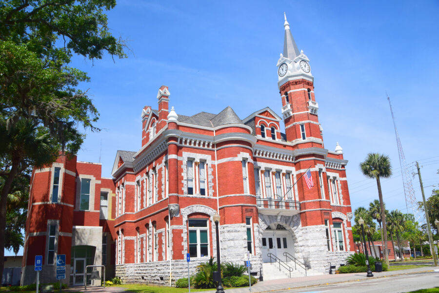 Exterior view of the historic Old City Hall building in Brunswick, Georgia, showcasing its architectural details and charm