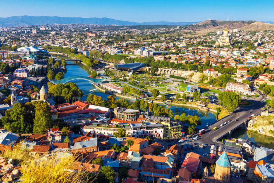 Aerial view from the funicular showcasing traditional wooden balconies of Old Town Tbilisi, Georgia, surrounded by picturesque houses