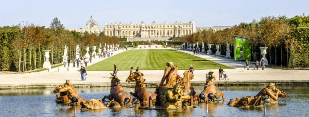 The Apollo Fountain at Versailles, featuring exquisite architecture and lush gardens, a highlight of French elegance